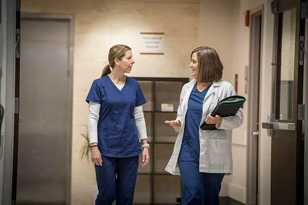 Two Female Medical Professionals Talking