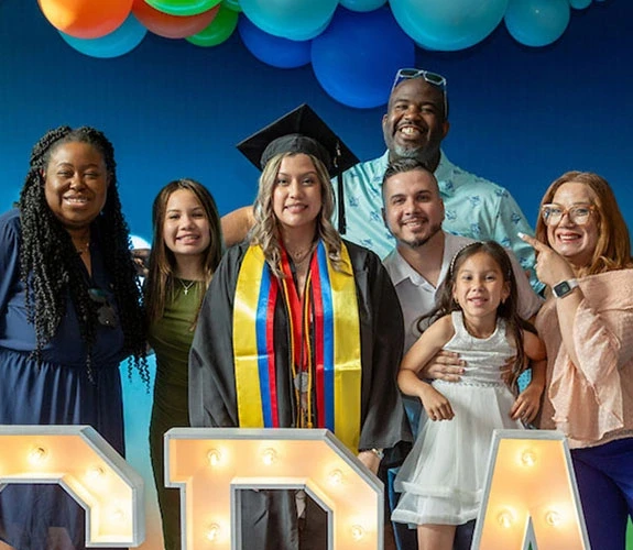 graduate with family