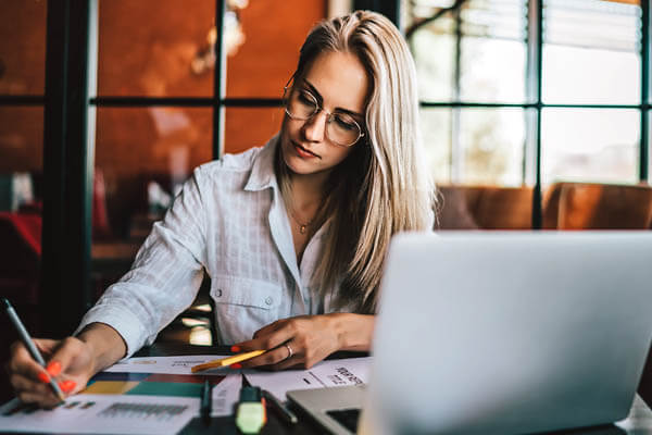 woman sitting in front of laptop